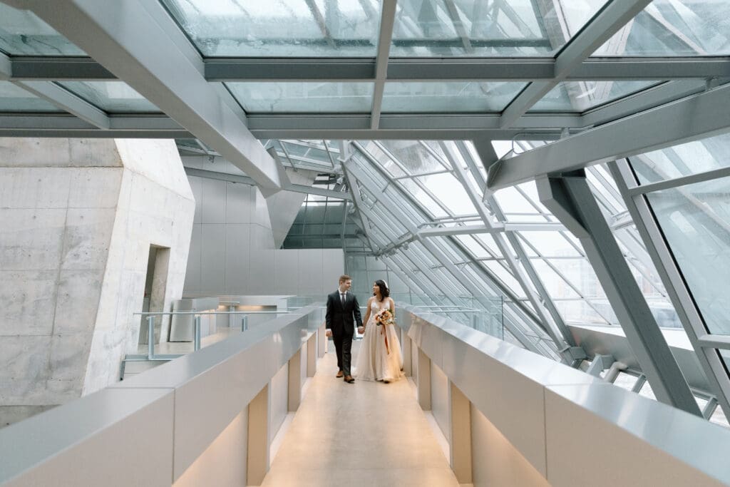 Couple walking in the lobby of the Akron Art Museum.