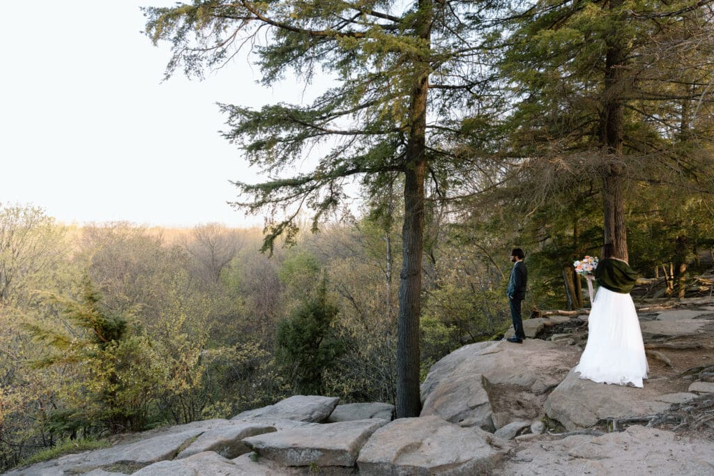 Bride walking up to groom on the overlook at Cuyahoga Valley National Park during an Ohio elopement.