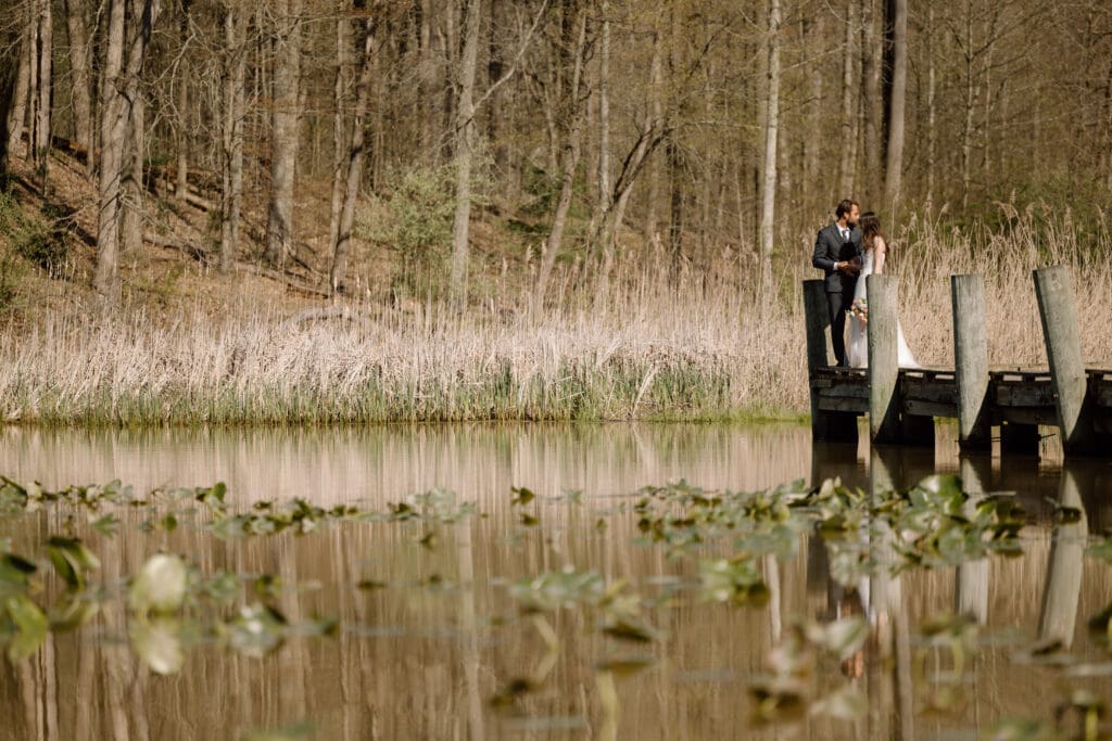 Eloping couple at the end of the dock at Kendall Lake in Cuyahoga Valley National Park.