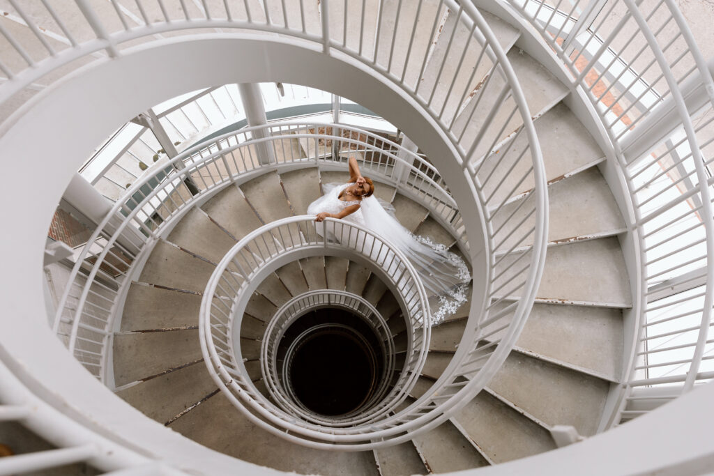 Eloping bride in a spiral staircase near the Akron Art Museum.