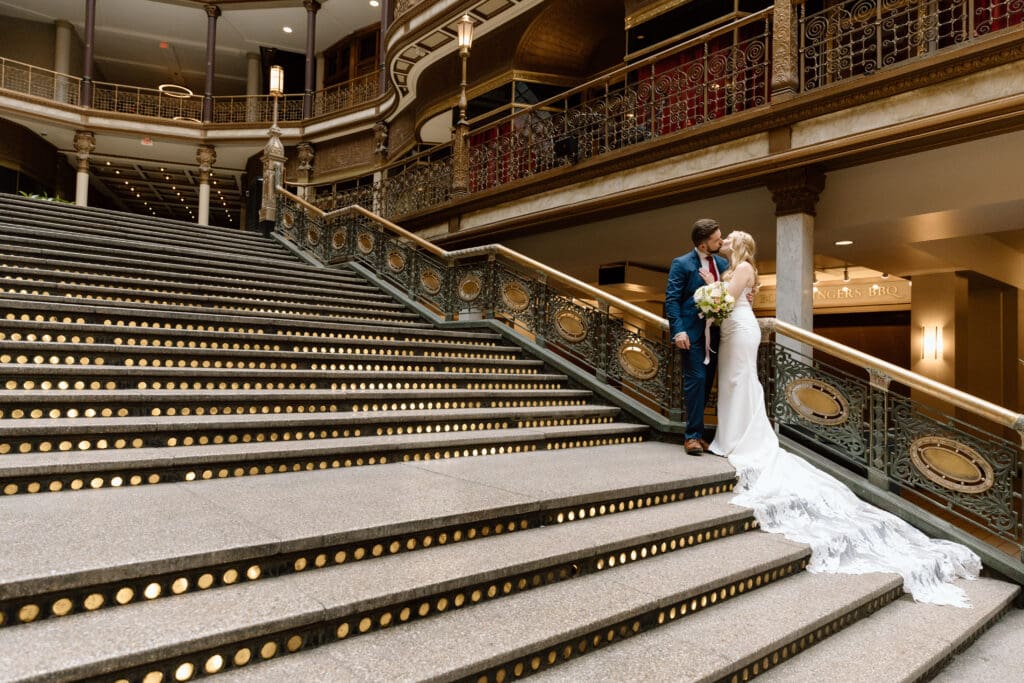 Couple kissing on the stairs at the Cleveland Arcade.