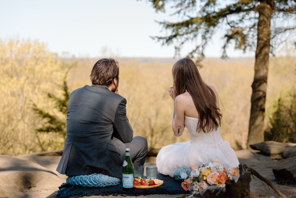 Elopement couple eating a morning picnic at an overlook in Ohio.