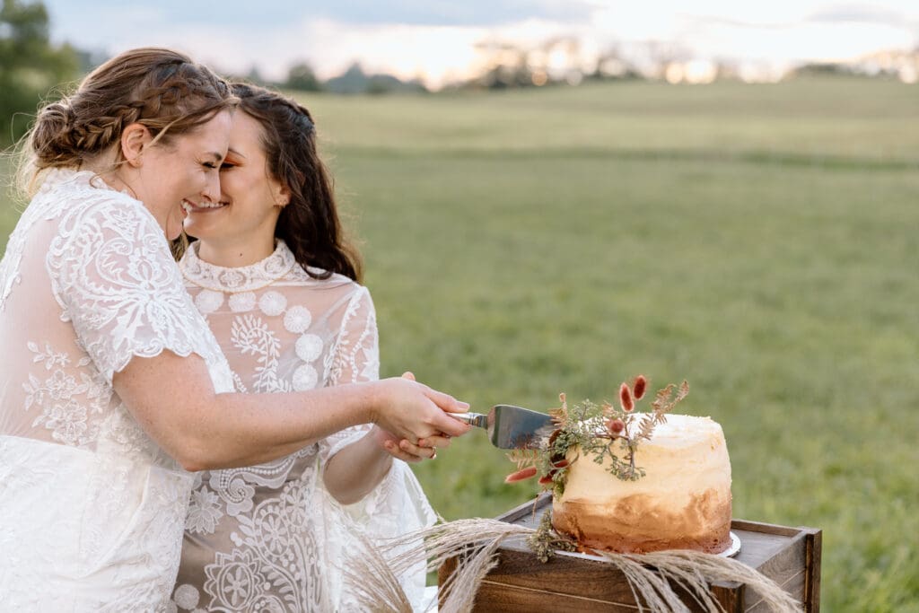 Couple cutting a wedding cake on their elopement day.