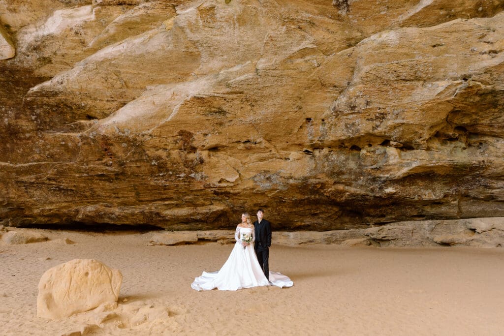 Elopement couple under the overhang in Ash Cave.