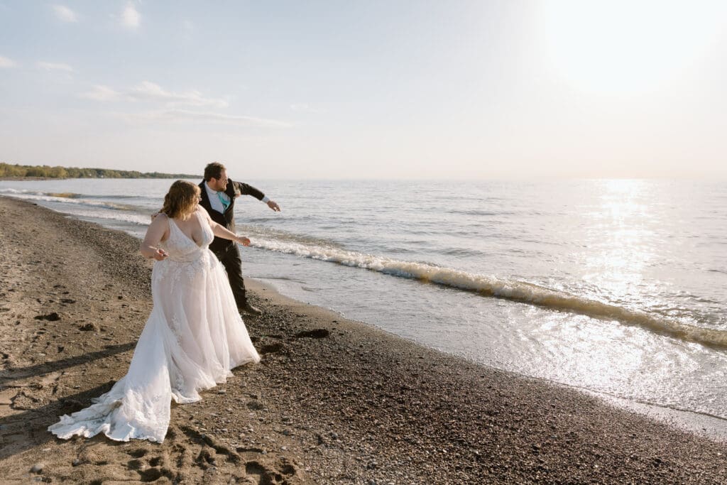 Eloping couple skipping rocks on Lake Erie.
