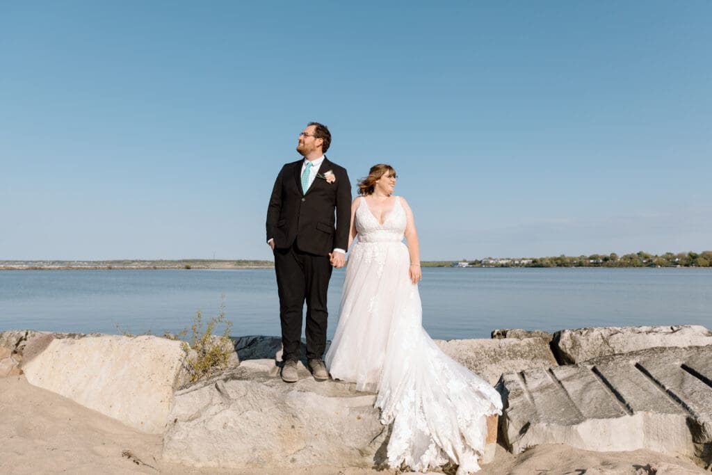 Elopement couple standing on the rocks at Headlands Beach State Park.