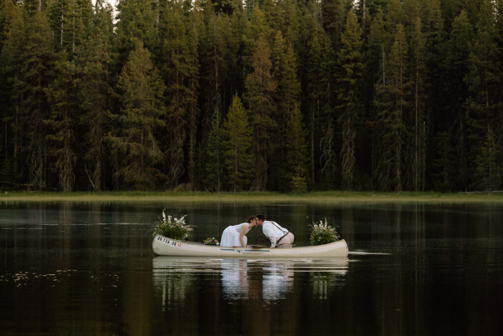 Couple kissing in a canoe in Central Oregon.