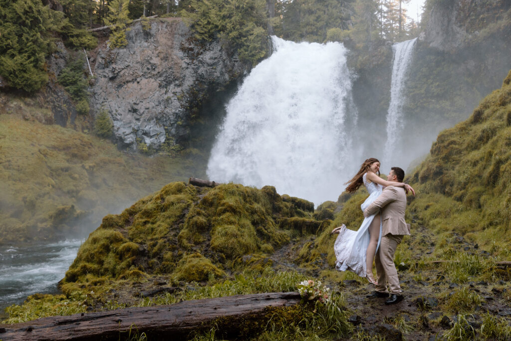 Couple spinning at a waterfall in Central Oregon.