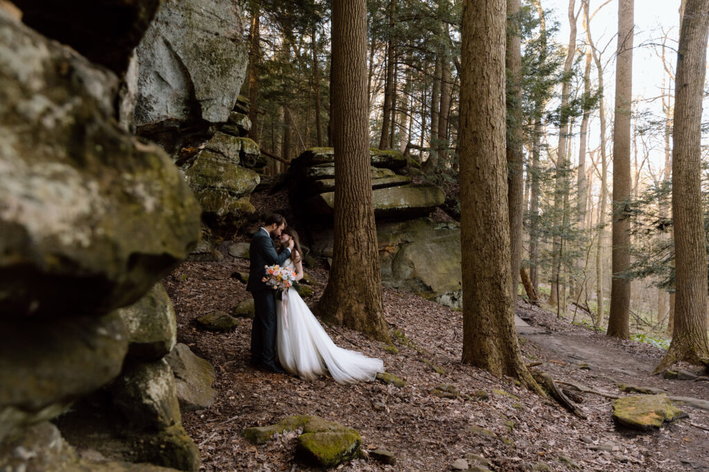 Couple embracing among rock ledges in Cuyahoga Valley National Park.
