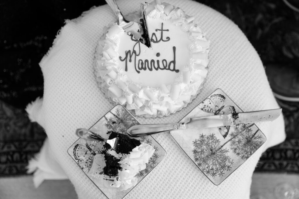 Partially eaten cake that says Just Married.