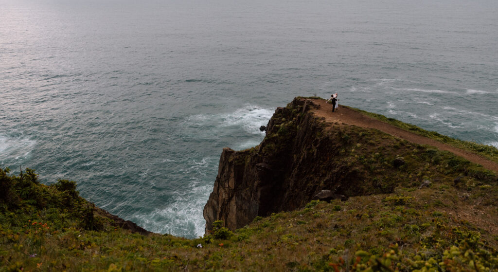 Couple spinning near a cliff point.