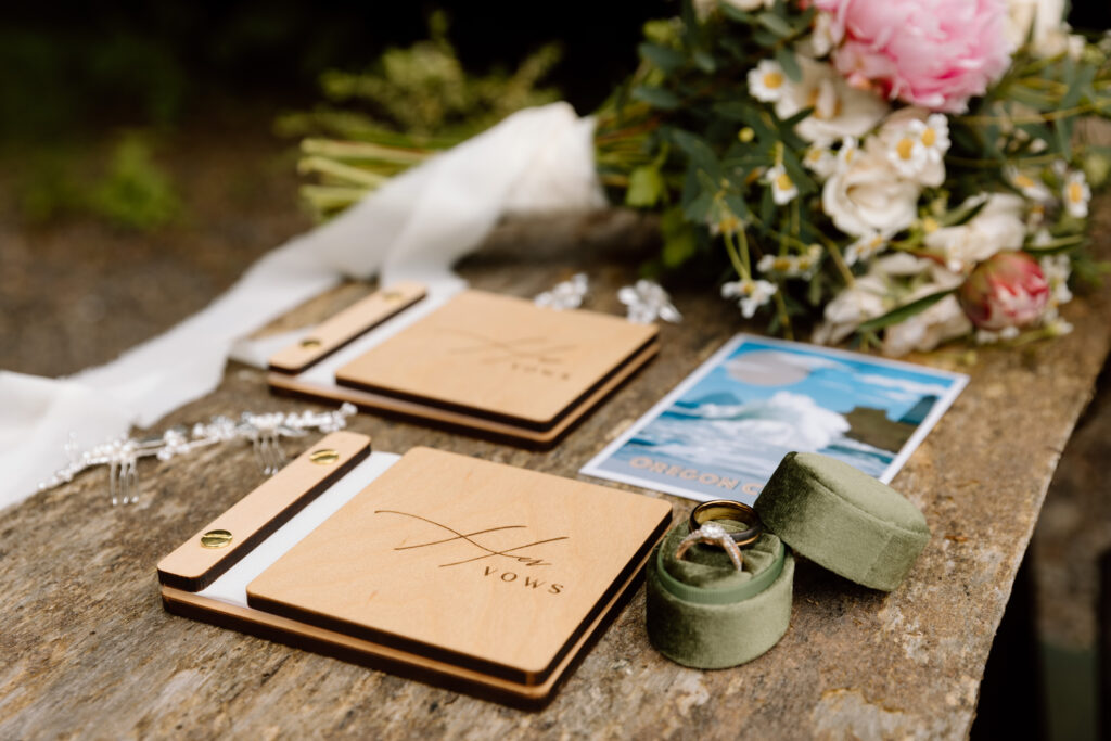Details including vow books, flowers, rings, and a postcard. 