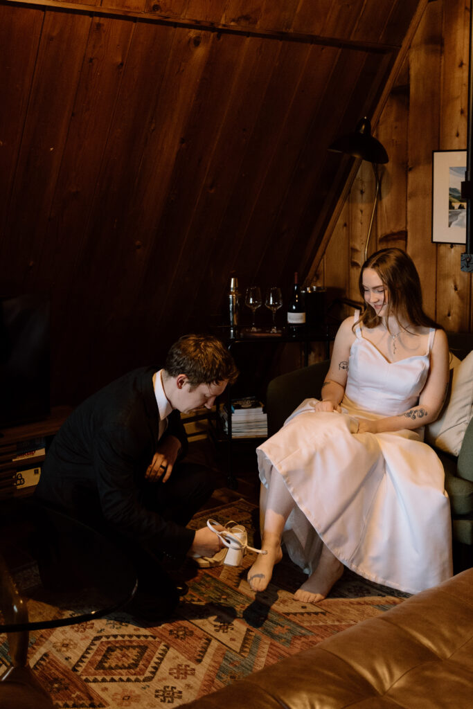 Couple getting ready together in their Airbnb.