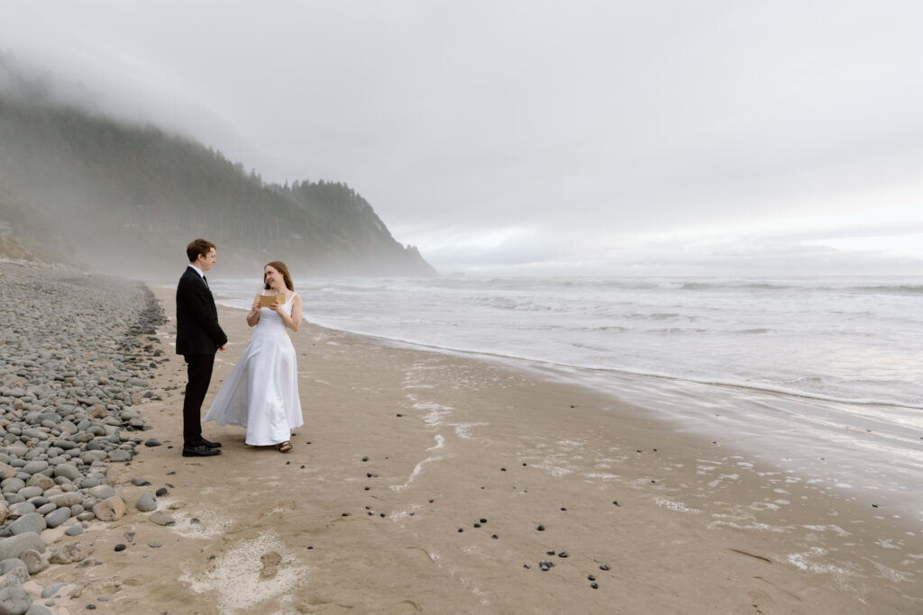 Couple saying their vows on the beach of the Oregon Coast.