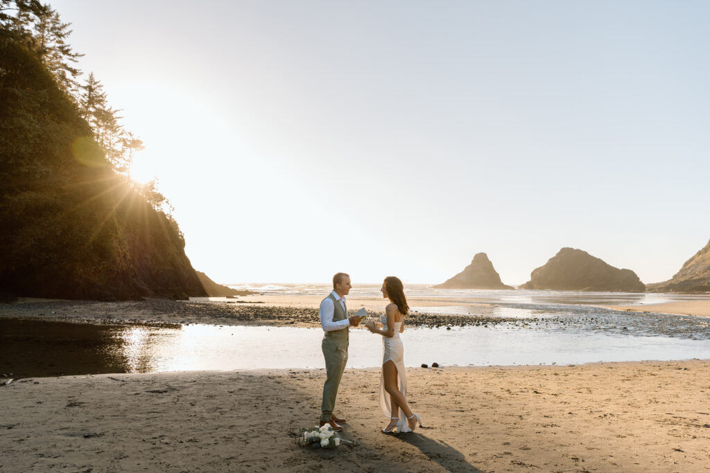 Bride and groom saying vows on Heceta Head Beach.