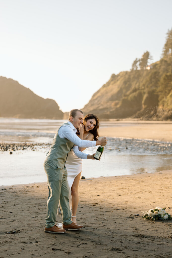 Bride and groom laughing as sparkling tea runs out.