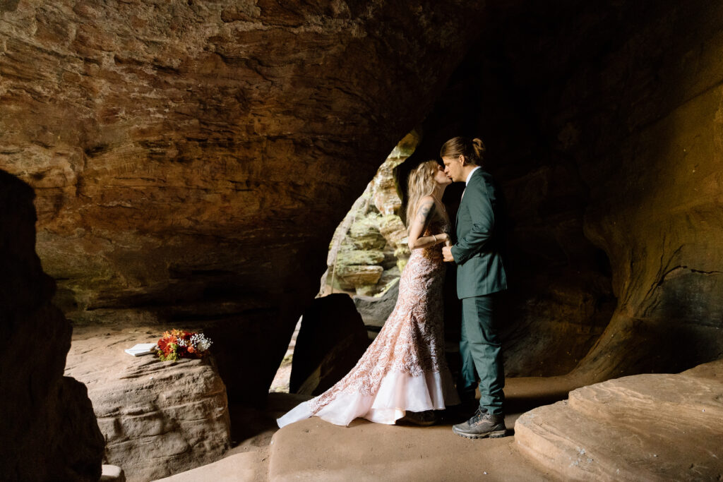 Couple kissing in Rock House cave.