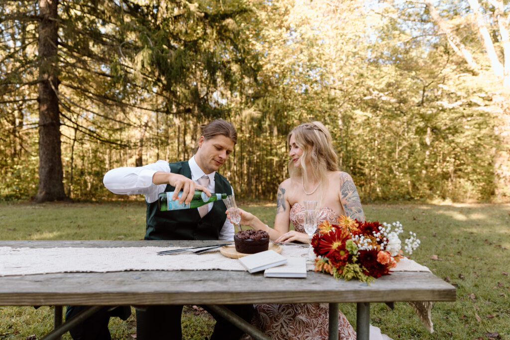 Groom pouring bride sparkling water.