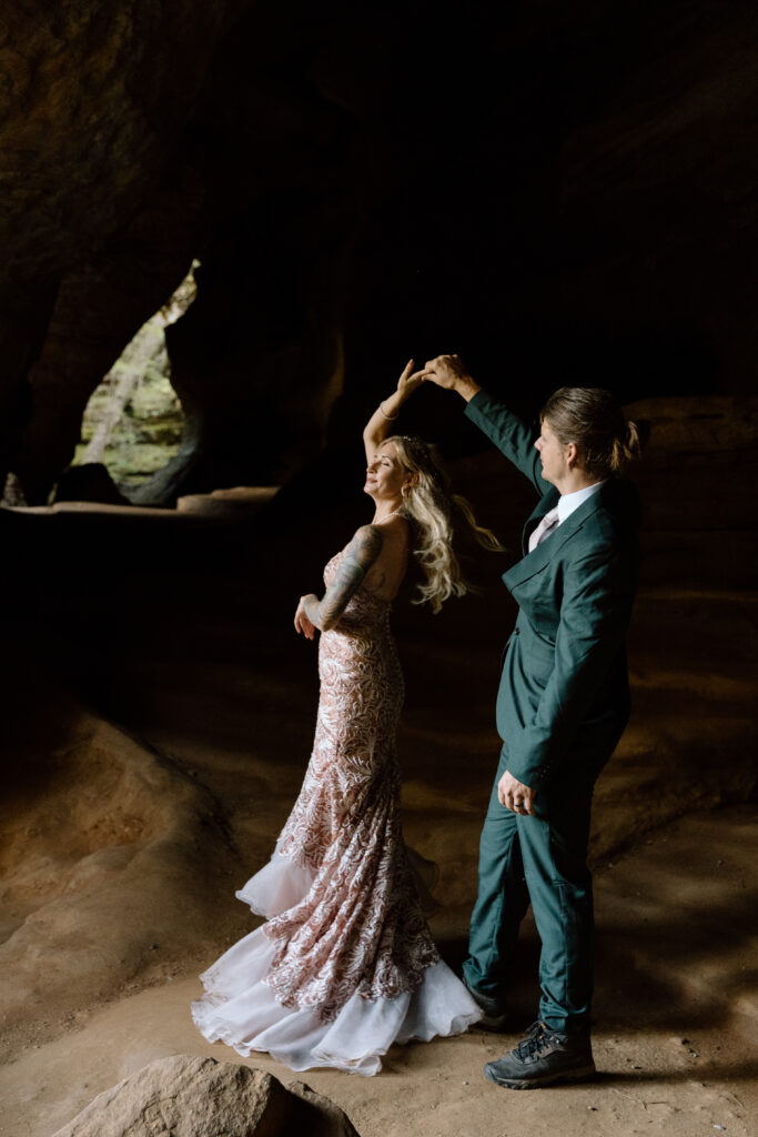 Groom spinning bride in Rock House.