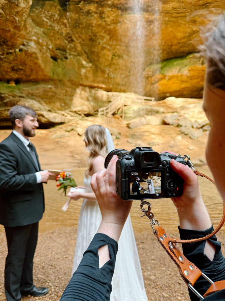Desiree photographing an eloping couple in Hocking Hills.