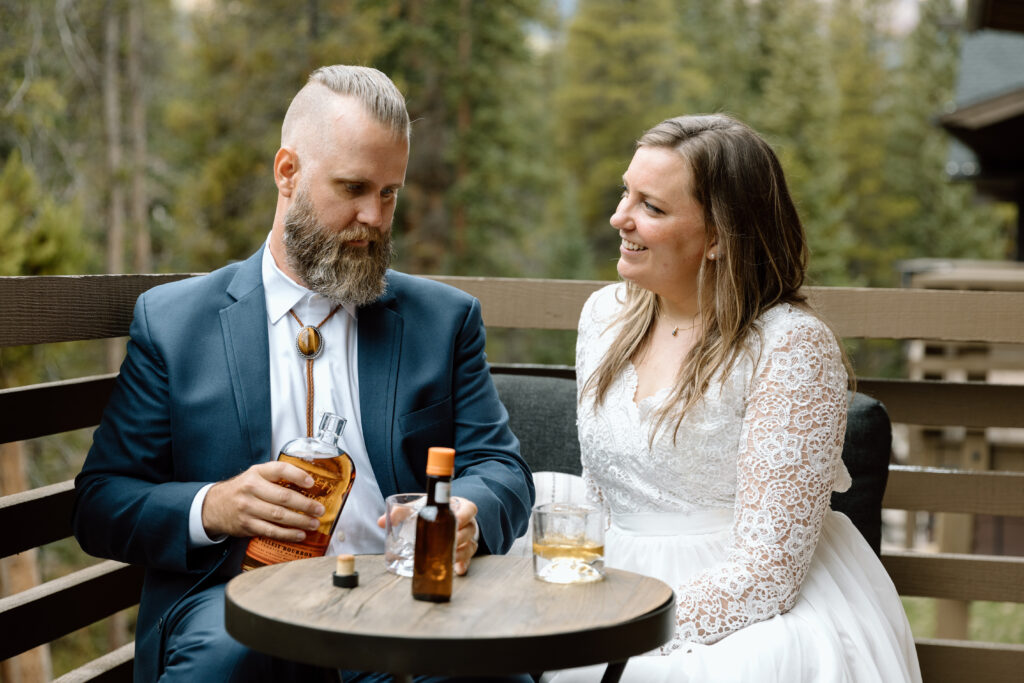 Couple making their favorite alcoholic drink during their elopement.