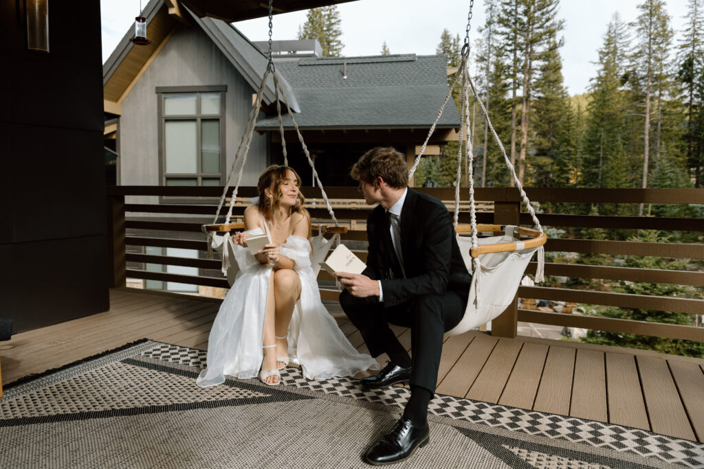 Couple writing their vows at their Airbnb.