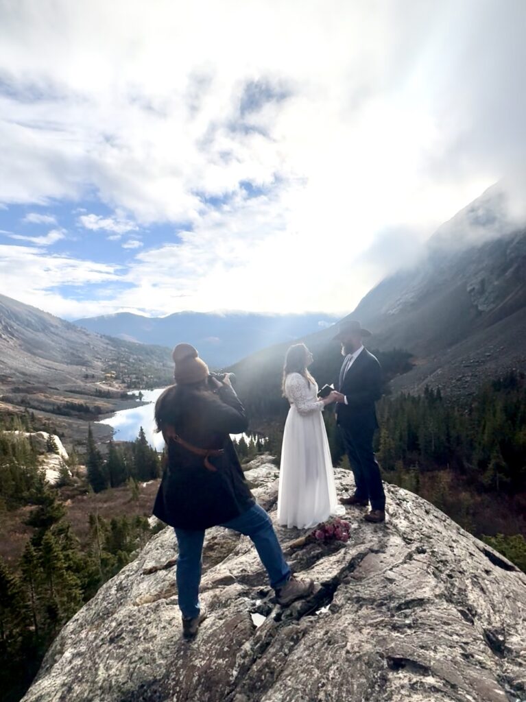 Desiree photographing an eloping couple.