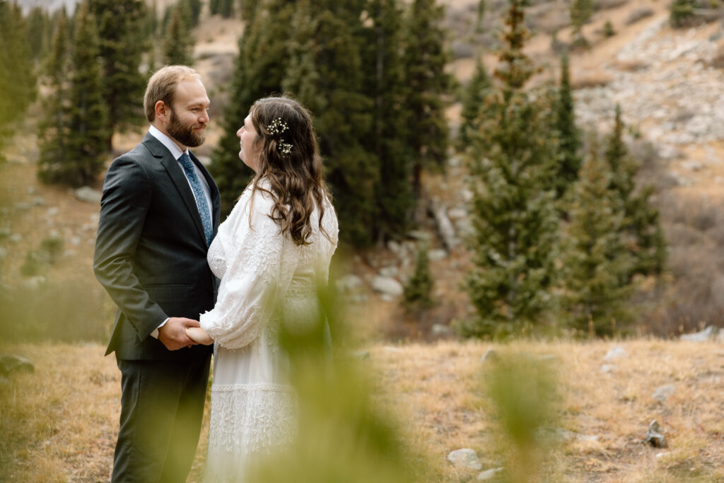 Couple embracing in the Colorado mountains.