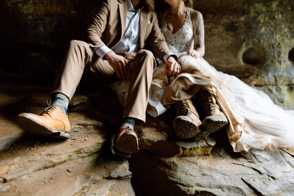 Close up photo of couple sitting with their shoes.