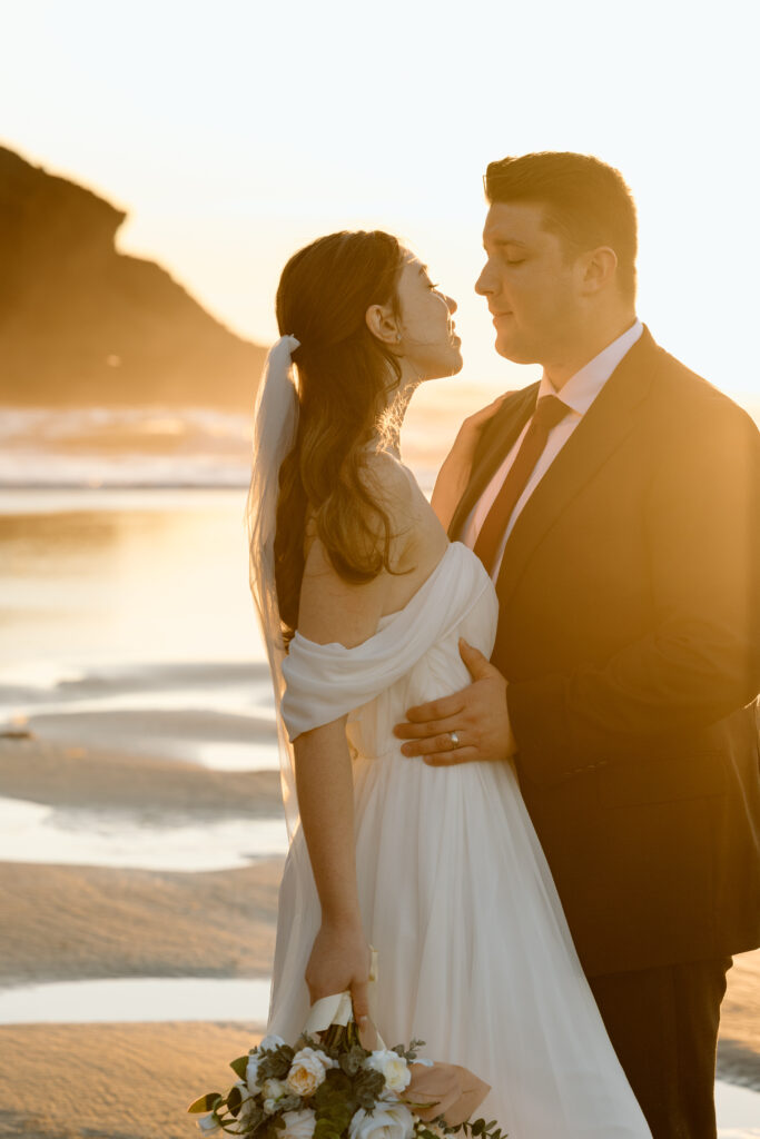 Bride and groom embracing.