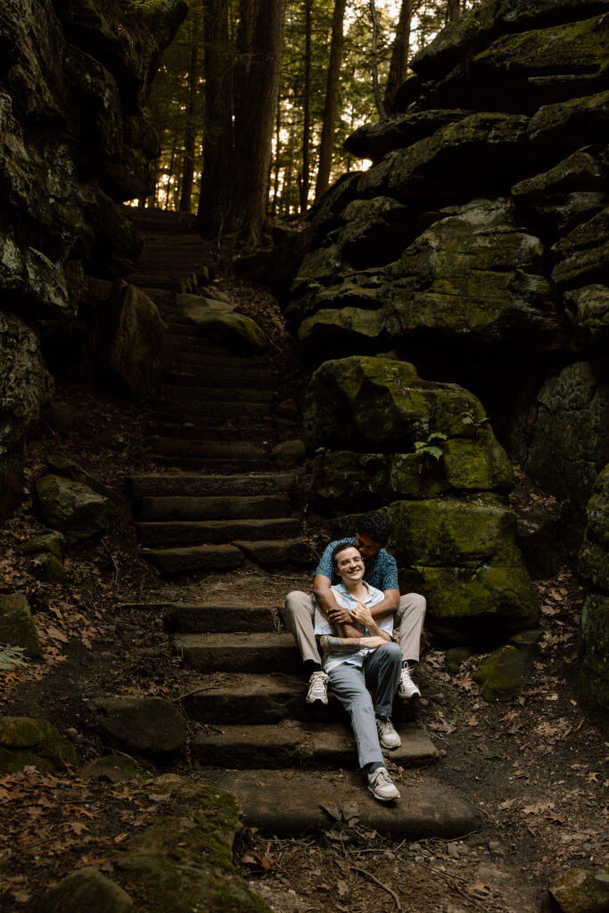 Couple sitting on stairs in Ledges.