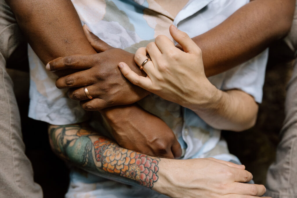 Close up of couple's hands as they embrace