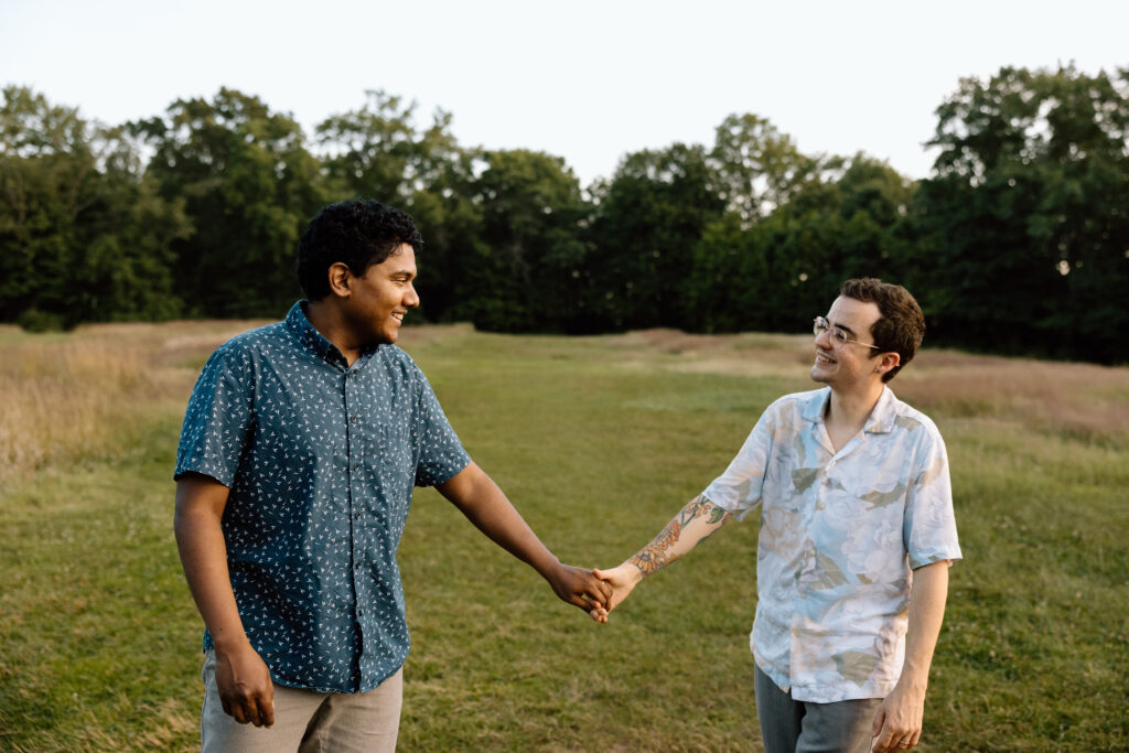 Couple holding hands and walking.