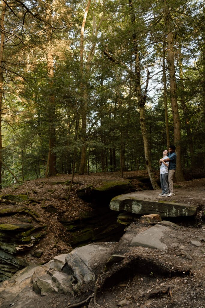Couple embracing near some cliff areas.