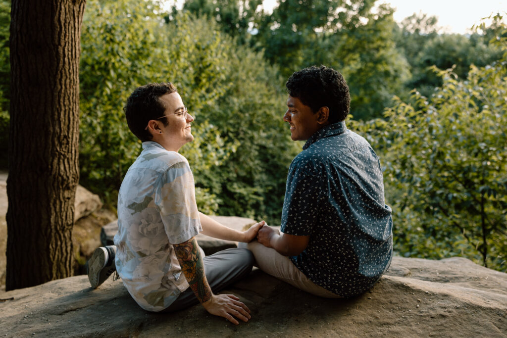 Couple sitting at ledges.