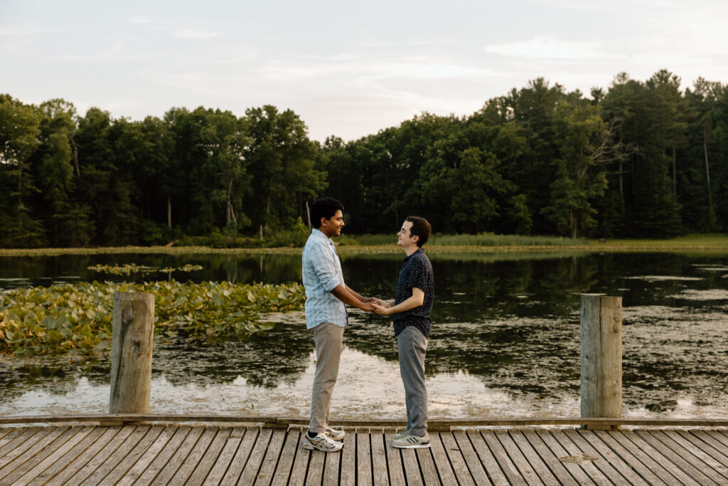 Couple holding hands at Kendall Lake in CVNP