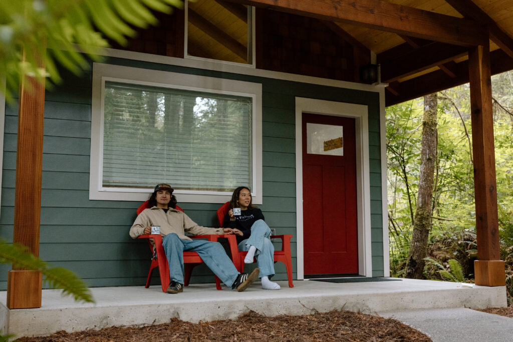 Couple drinking coffee at their airbnb in the Redwoods
