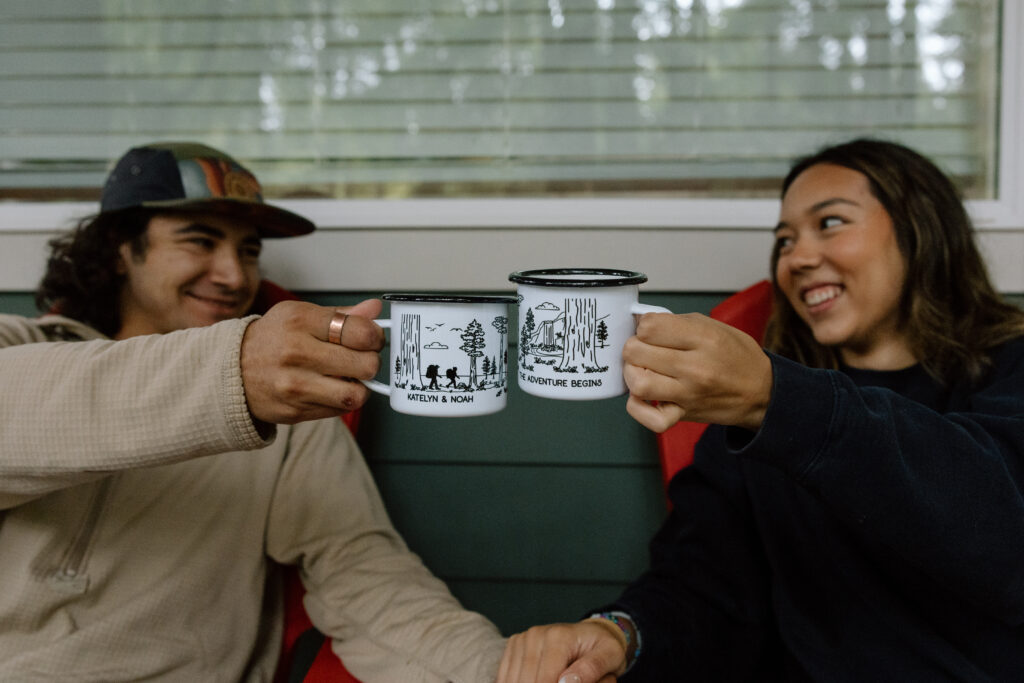 Couple toasting with their coffee cups that have their names written