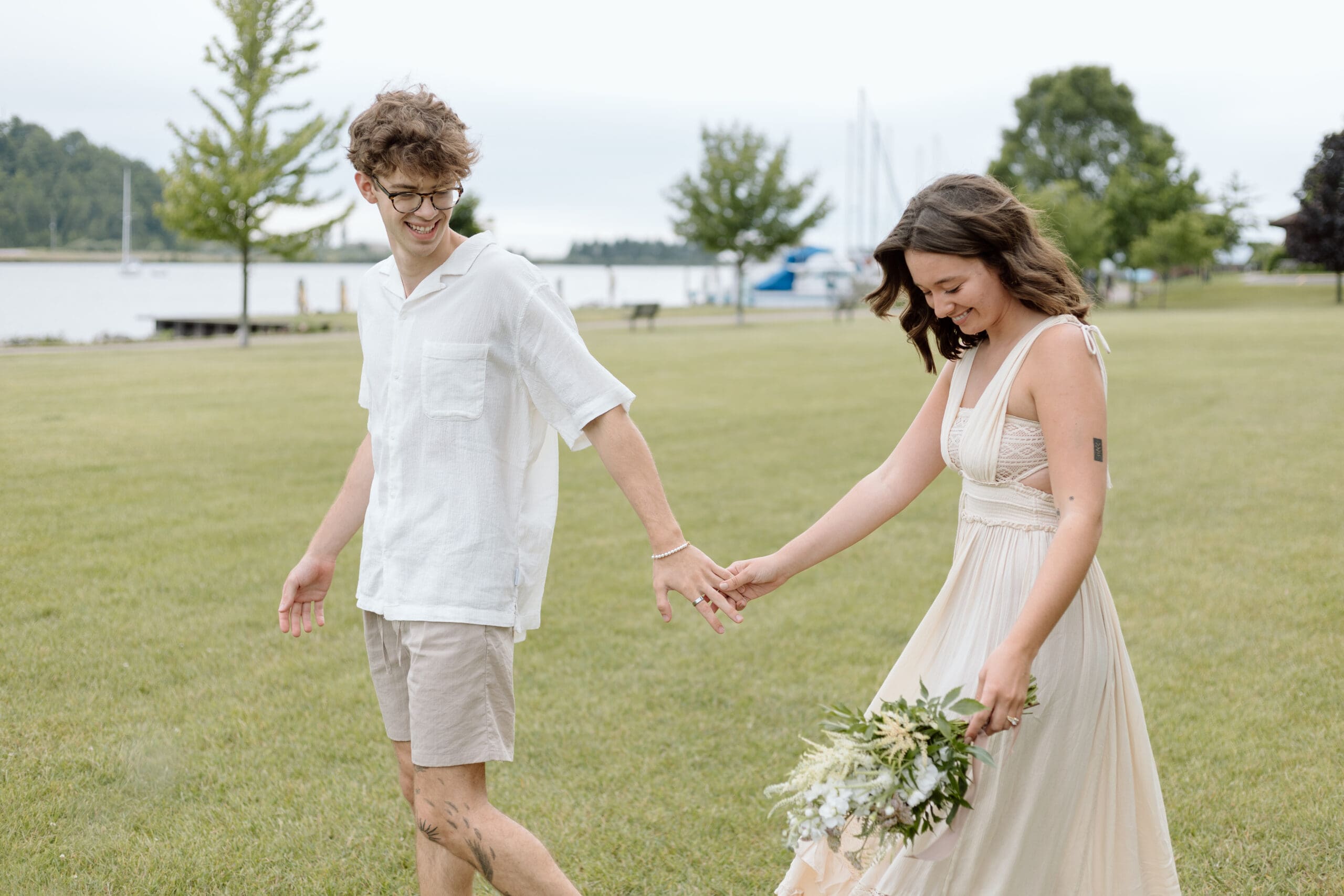 Couple walking in a park in Frankfort, Michigan.